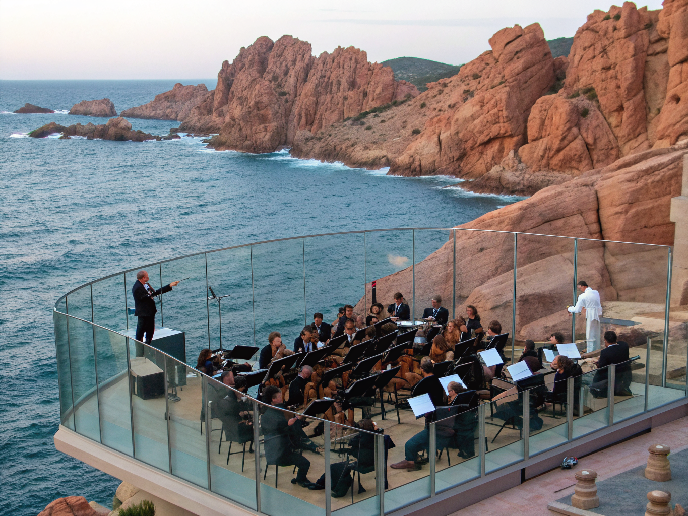 Orchestral performance with coastal silhouettes